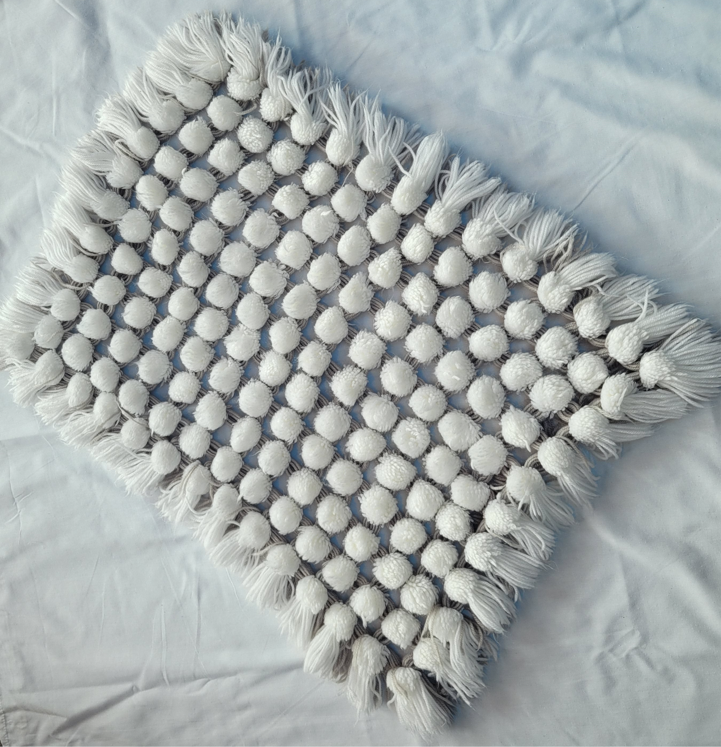 Hand knitted Pom-Pom, Pram Blanket
